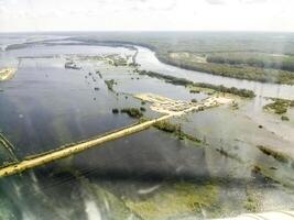 Top view of the oil and gas field. Wetlands and entrances to industrial facilities. photo