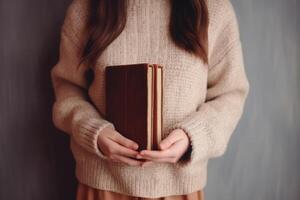 AI generated Magazine or book image mockup. girl holding a closed book in her hands. AI Generated photo