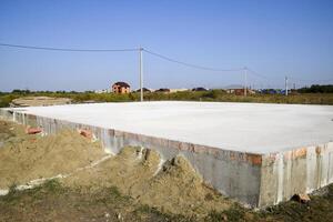 Filled foundation of the house and floors. Home construction. photo