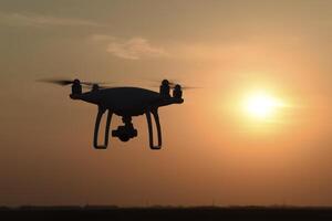 drone silhouette against the background of the sunset photo