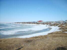 Coastal landscape of the tundra settlement photo