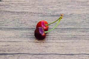 Cherry berries on a wooden background. Ripe red sweet cherry photo