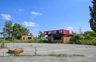 Burned gas station. Ruins in the place of a burnt petrol station. photo