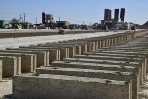 Cinder blocks lie on the ground and dried. on cinder block production plant. photo