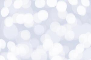 Beautiful sparkle silver and white abstract bokeh background. photo