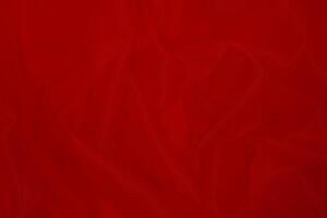 Red fabric texture background with copy space. photo