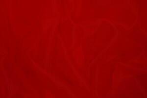 Red fabric texture background with copy space. photo