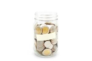Thai Baht coins in a glass jar. Business and finance concept. photo