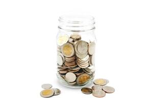 Thai Baht coins in a glass jar. Business and finance concept. photo