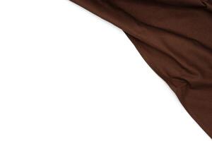 Wrinkled dark brown fabric with copy space. photo