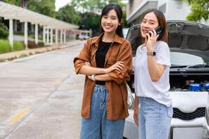 Two Drivers using a smartphone to exchange phone numbers and social media after a car accident. Concept of claim insurance for a car accident online after send photo and evidence to insurance company