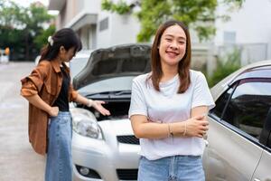 Happy women drivers do not worry after a car accident because have car accident insurance. And sad men drivers not have car accident insurance. photo