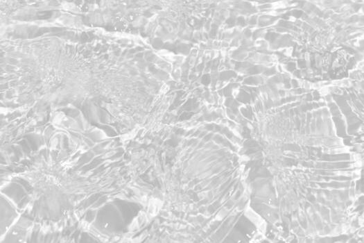 Bluewater waves on the surface ripples blurred. Defocus blurred transparent blue colored clear calm water surface texture with splash and bubbles. Water waves with shining pattern texture background. photo