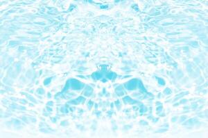 Bluewater waves on the surface ripples blurred. Defocus blurred transparent blue colored clear calm water surface texture with splash and bubbles. Water waves with shining pattern texture background. photo