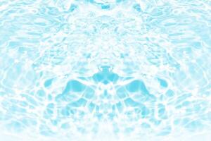 Bluewater waves on the surface ripples blurred. Defocus blurred transparent blue colored clear calm water surface texture with splash and bubbles. Water waves with shining pattern texture background. photo