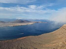 Mirador del Rio, Lanzarote's iconic viewpoint, offers a breathtaking panorama of the Atlantic and neighboring islands. photo