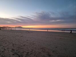 Sunset on Famara Beach on Lanzarote Island photo