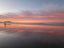 Sunset on Famara Beach on Lanzarote Island photo