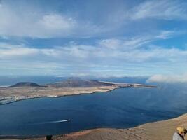 Mirador del Rio, Lanzarote's iconic viewpoint, offers a breathtaking panorama of the Atlantic and neighboring islands. photo