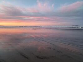 Sunset on Famara Beach on Lanzarote Island photo