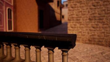 A close up of a railing with a brick building in the background video