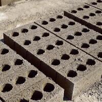 Cinder blocks lie on the ground and dried. on cinder block production plant. photo