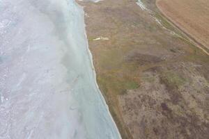 Saline Salt Lake in the Azov Sea coast. Former estuary. View from above. Dry lake. View of the salt lake with a bird's eye view photo