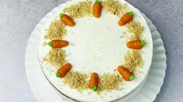 Homemade Easter carrot cake made with walnuts, iced with cream cheese. video