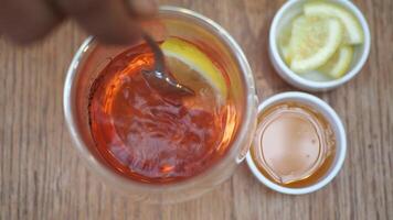 Top view of lemon tea and honey on table video