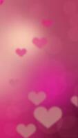 Vertical background video animation with flying hearts and bokeh on gradient background.