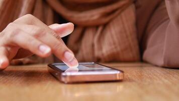 young women hand using smart phone. video