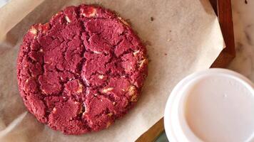 women hand creaking red velvet cookies video