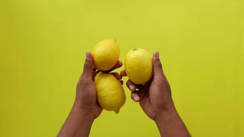 top view of holding Yellow Lemon video