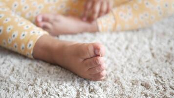 close up of dry child feet on carpet , video