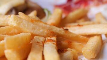 child hand pick french fries close up video