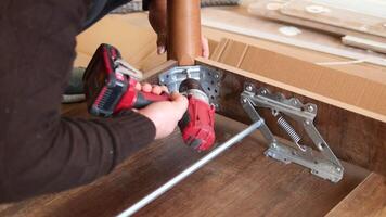 slow motion of using electric drilling on wooden table video