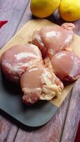 raw chicken meat on a chopping board with fresh vegetables video