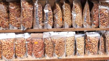 many mixed nuts in a plastic packet on shelf video