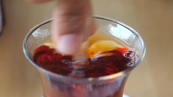 stirring Traditional turkish tea on white table . video