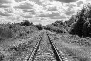Photography to theme railway track after passing train on railroad photo