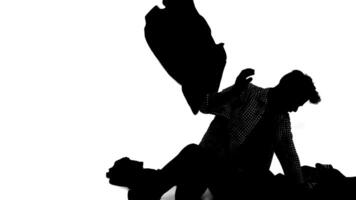 Silhouette of a person in a dynamic pose against a white background video