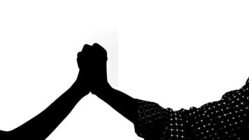 Silhouetted hands in a fist bump gesture against a white background, symbolizing friendship or agreement. video