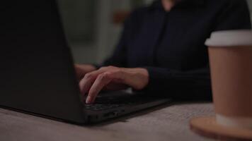 Businessman's hands typing on a computer keyboard to search for information. market research online communication support and doing business reports on the office desk at night. video