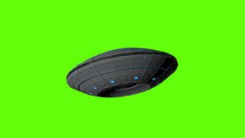 UFO flying round spaceship flying bottom up against green background. 3D animation video