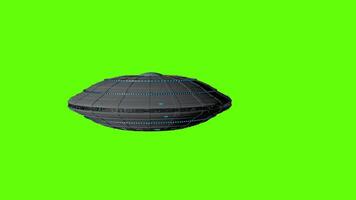 UFO flying round spaceship flying from left to right against green background. 3D animation video