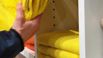 Shopping. Yellow bright solid towel for pool and bath, premium home textiles. video