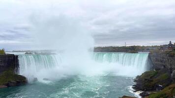 Niagara Falls in autumn Full-flowing River and Horseshoe Falls. Beautiful view of the falling stream of water. video