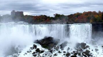 Full-flowing Niagara Falls in the fall. Mesmerizing view of the falling water. The strength and power of nature. American Niagara Falls. video