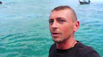 Man tourist on ferry to Koh Phi Phi island Thailand. video