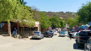 Puerto Escondido Oaxaca Mexico 2023 Typical beautiful colorful tourist street sidewalk city Puerto Escondido Mexico. video